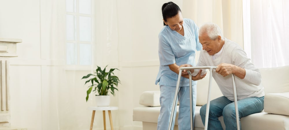 Nurse Helping Elderly Man