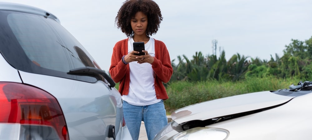 GIrl photographing car accident