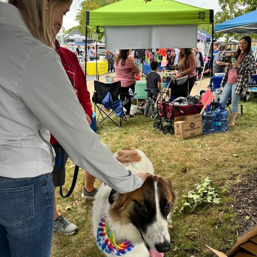 Image of Taylor Kosla Unterberg Petting a Dog