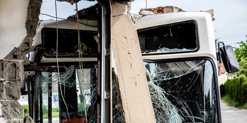 Suing a City, County or the State in Illinois: The Tort Immunity Act 1 A city bus with a shattered windshield after crashing into a building